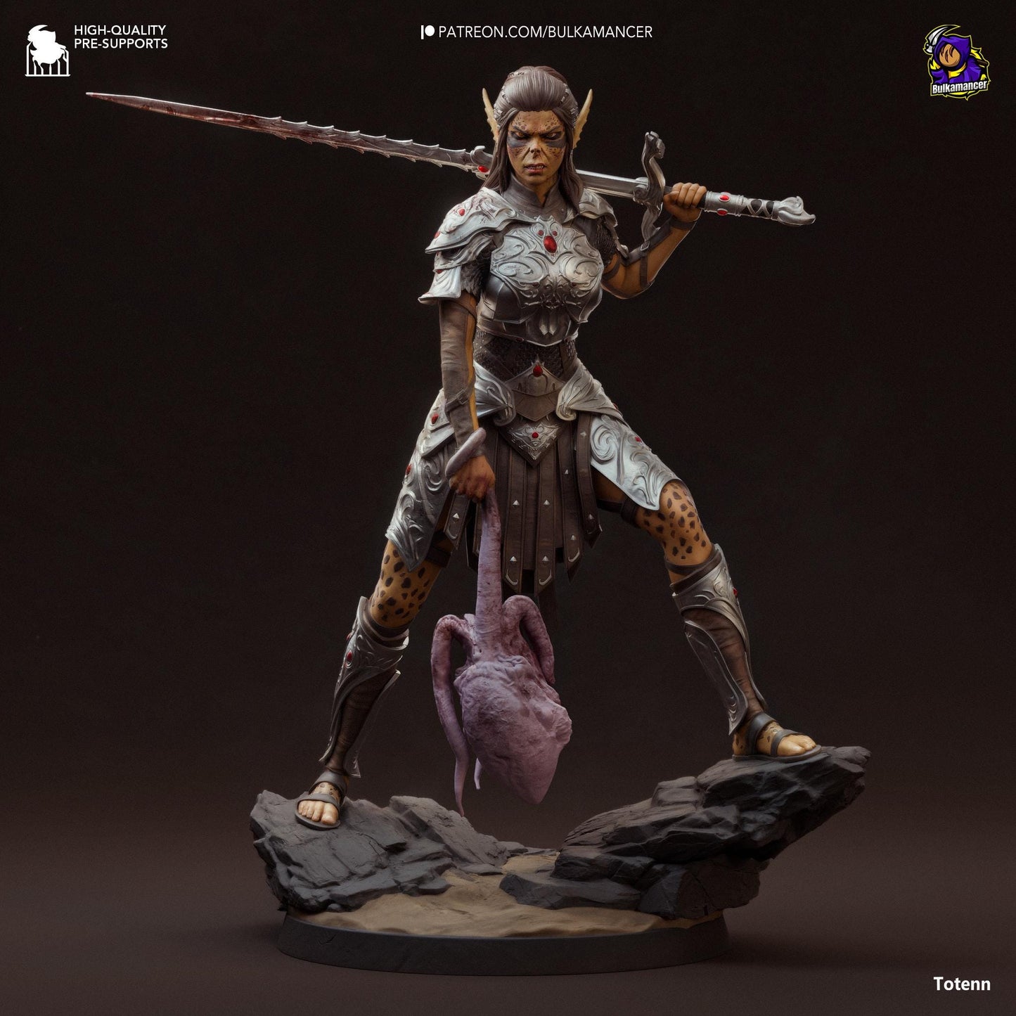 a statue of a woman with a sword on a rock