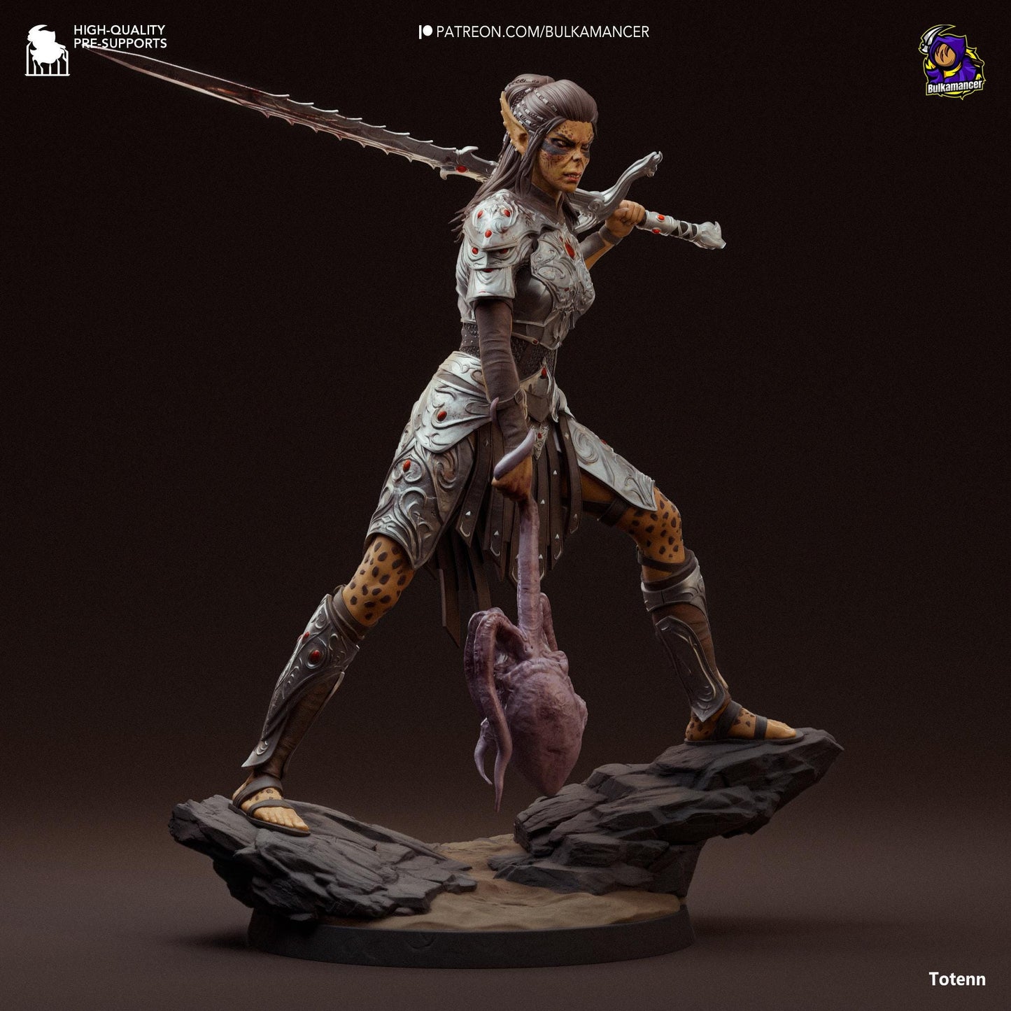 a statue of a woman with a sword on a rock