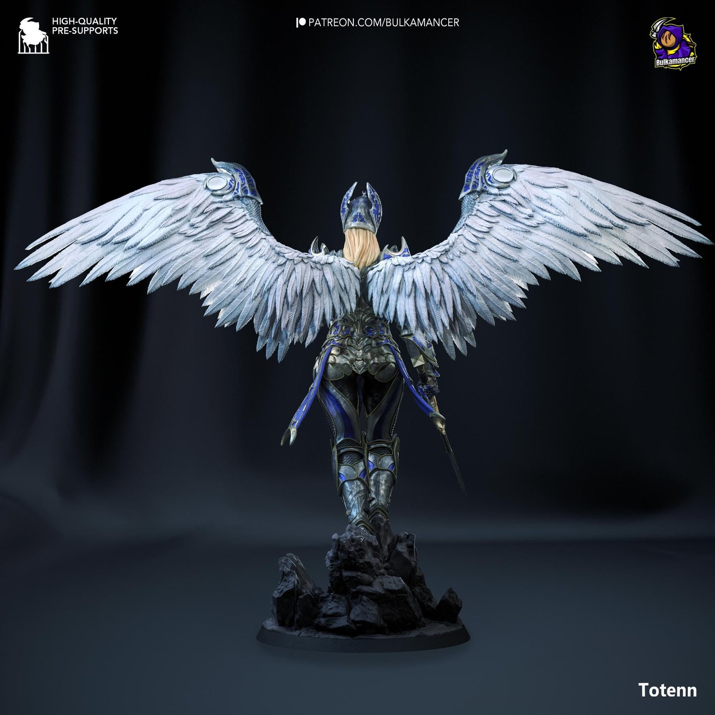 a statue of an angel with white wings
