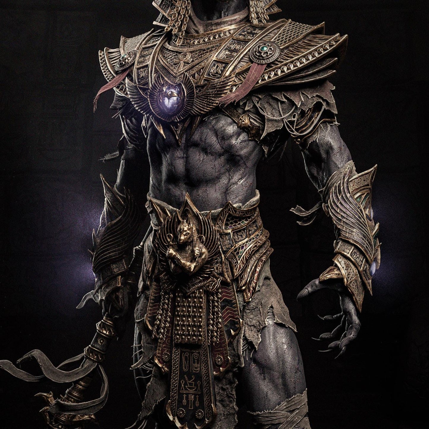 a statue of a man in armor with a sword