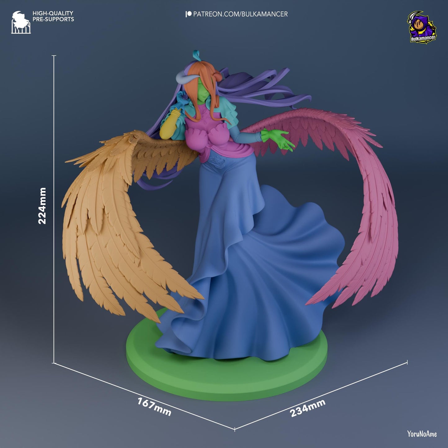 a figurine of a woman with wings on a green base