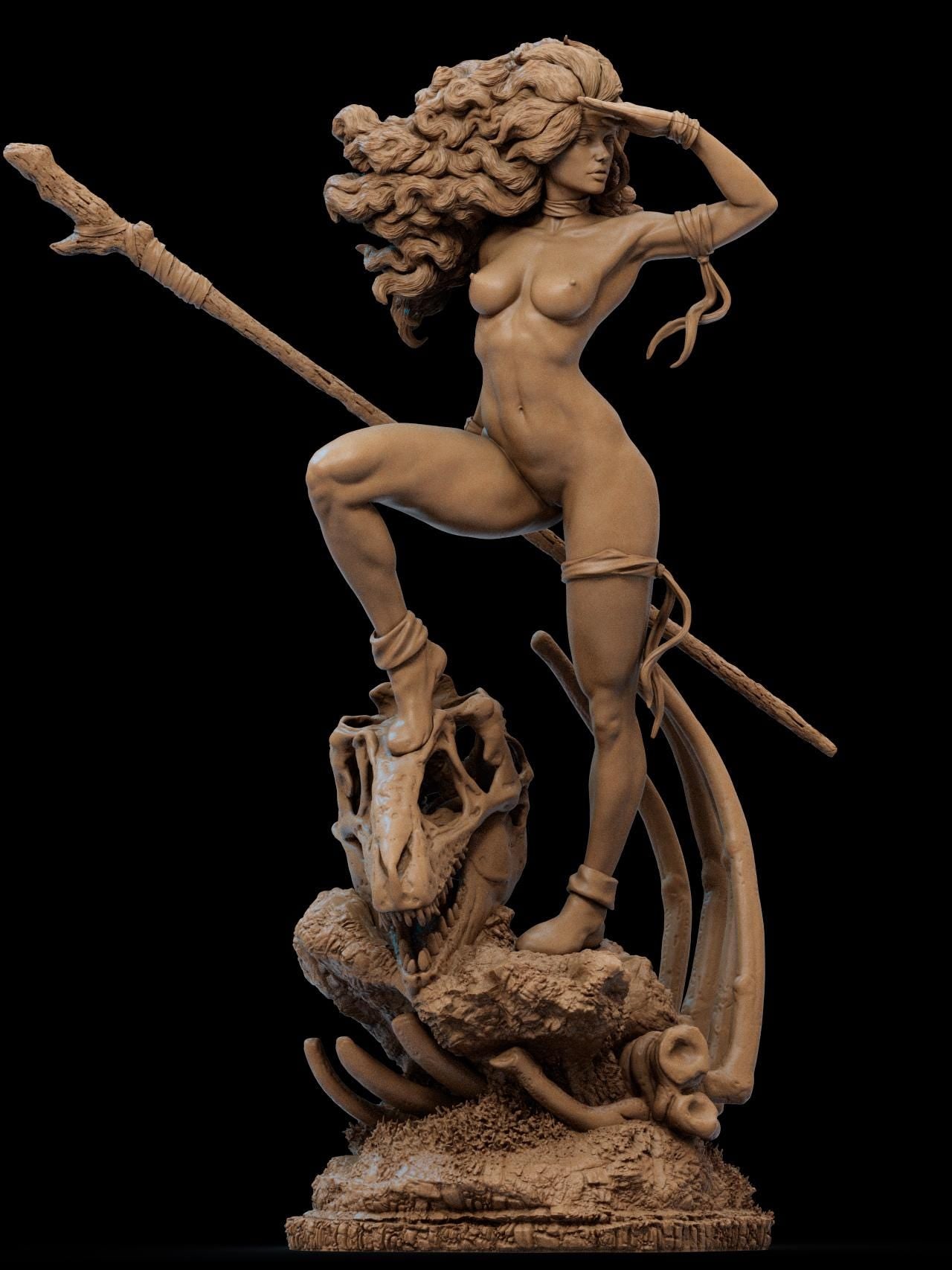 a statue of a naked woman holding a spear