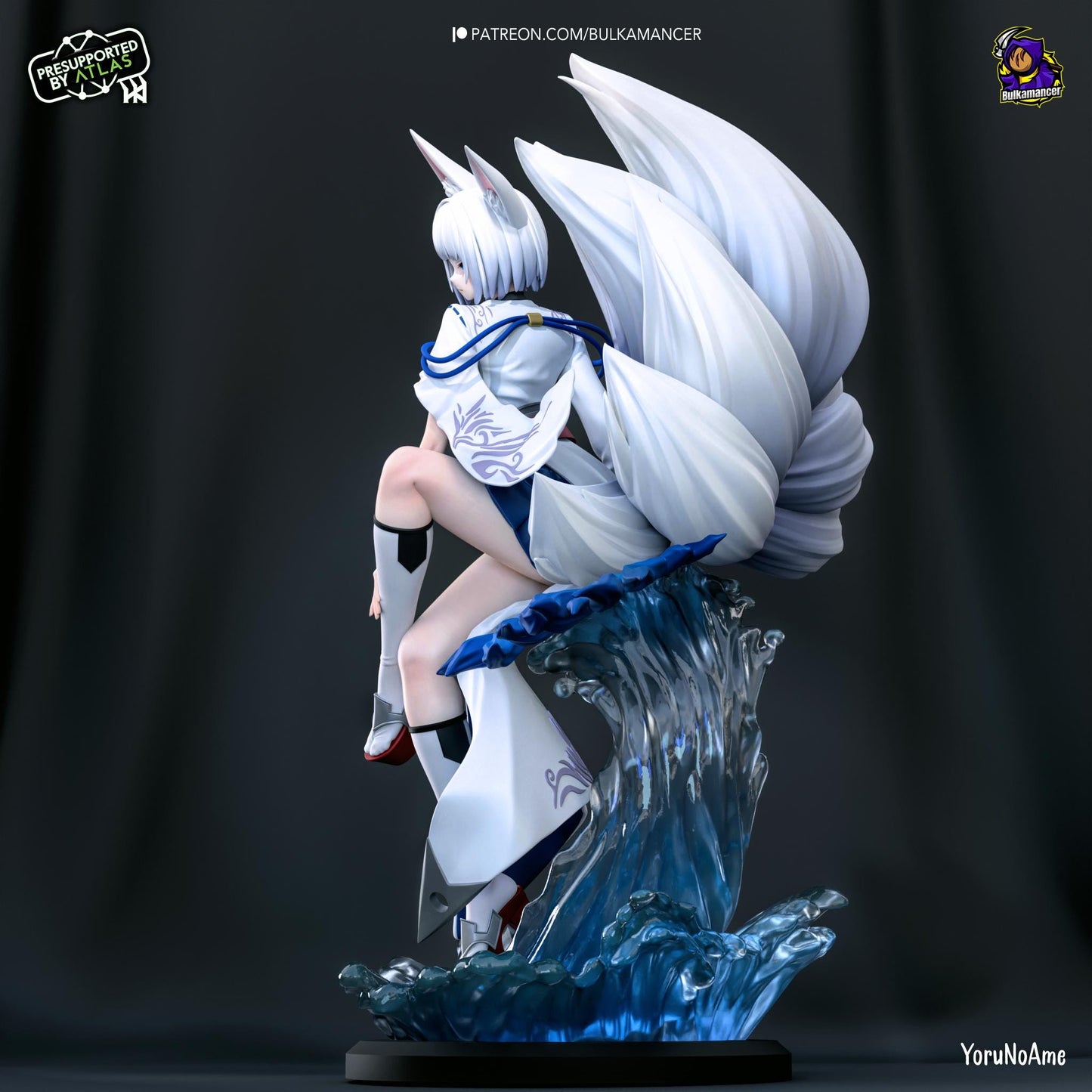 a statue of a woman sitting on top of a wave