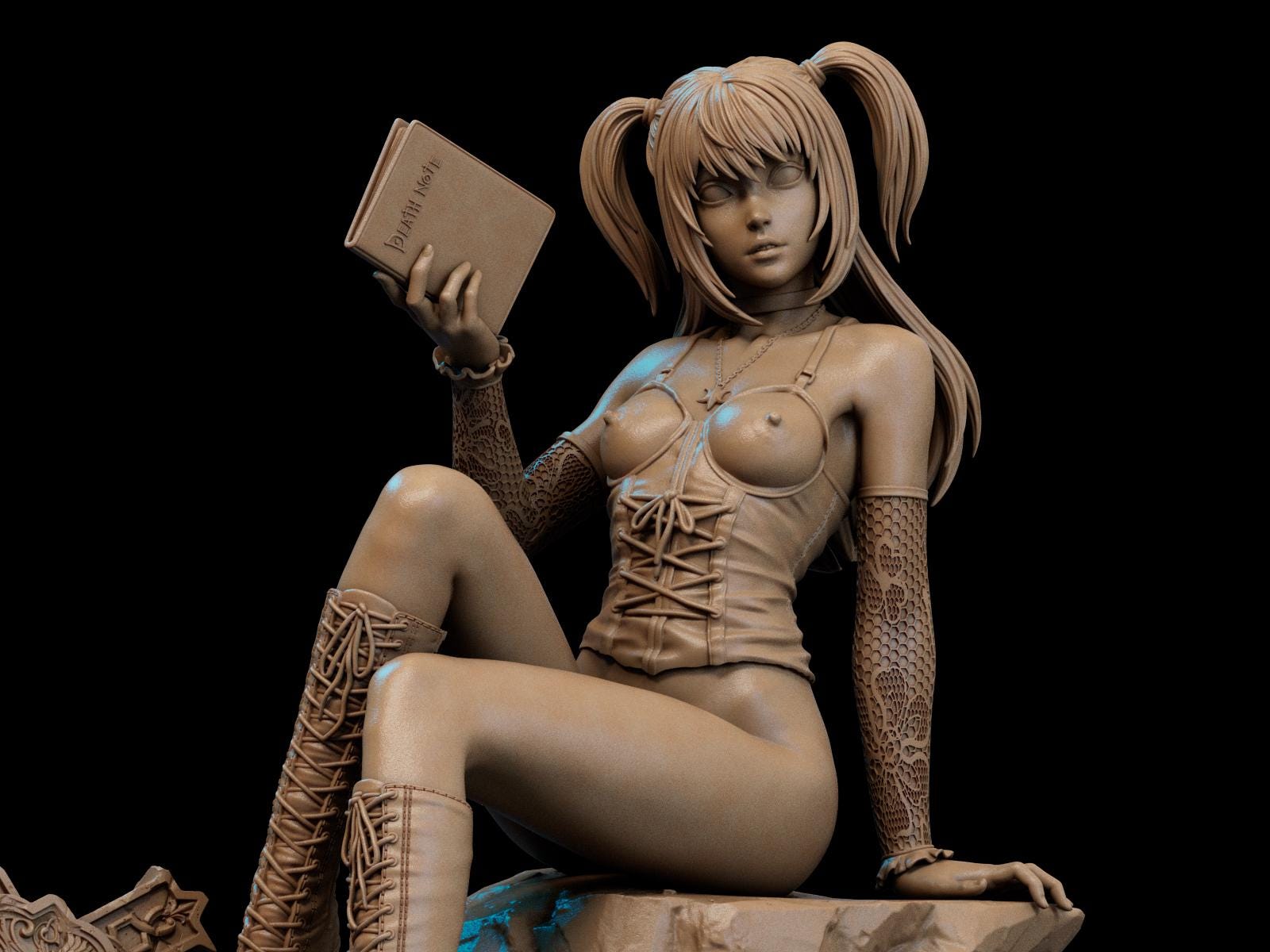 a statue of a woman sitting on a rock holding a book