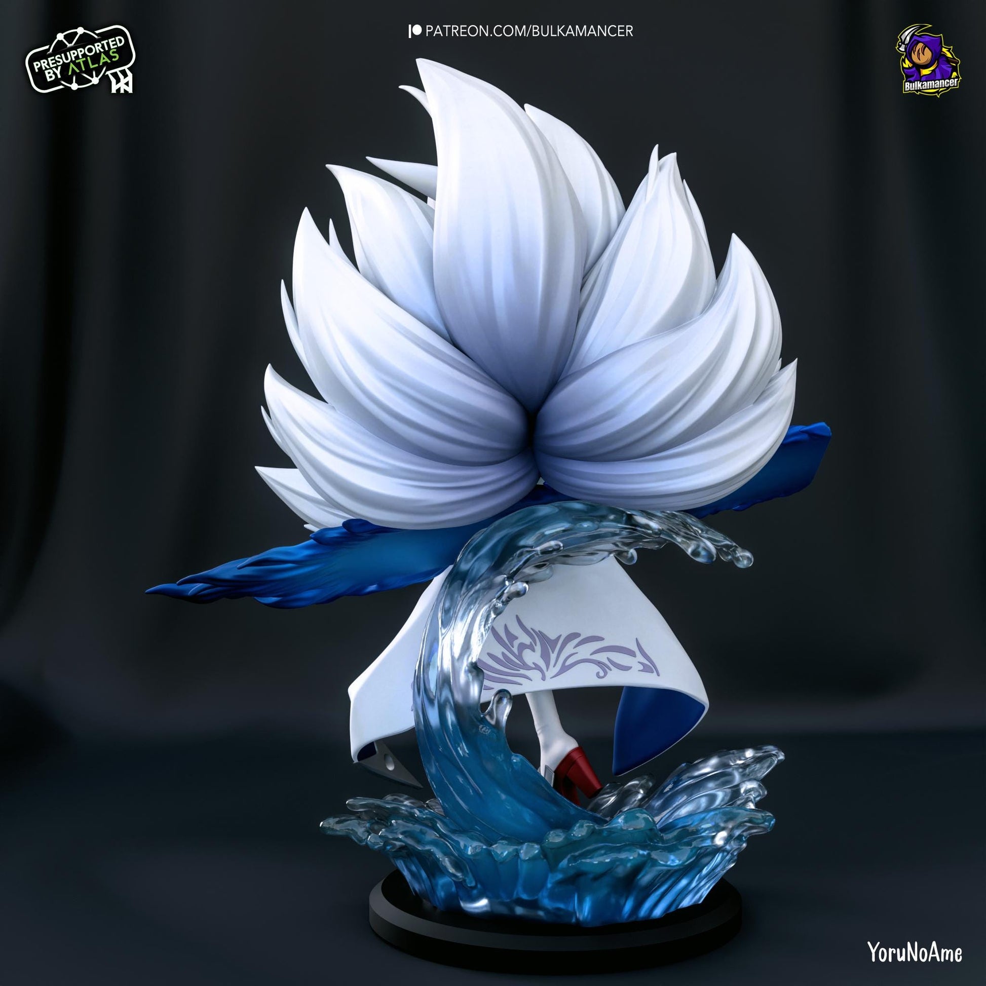 a white and blue sculpture of a bird on a wave
