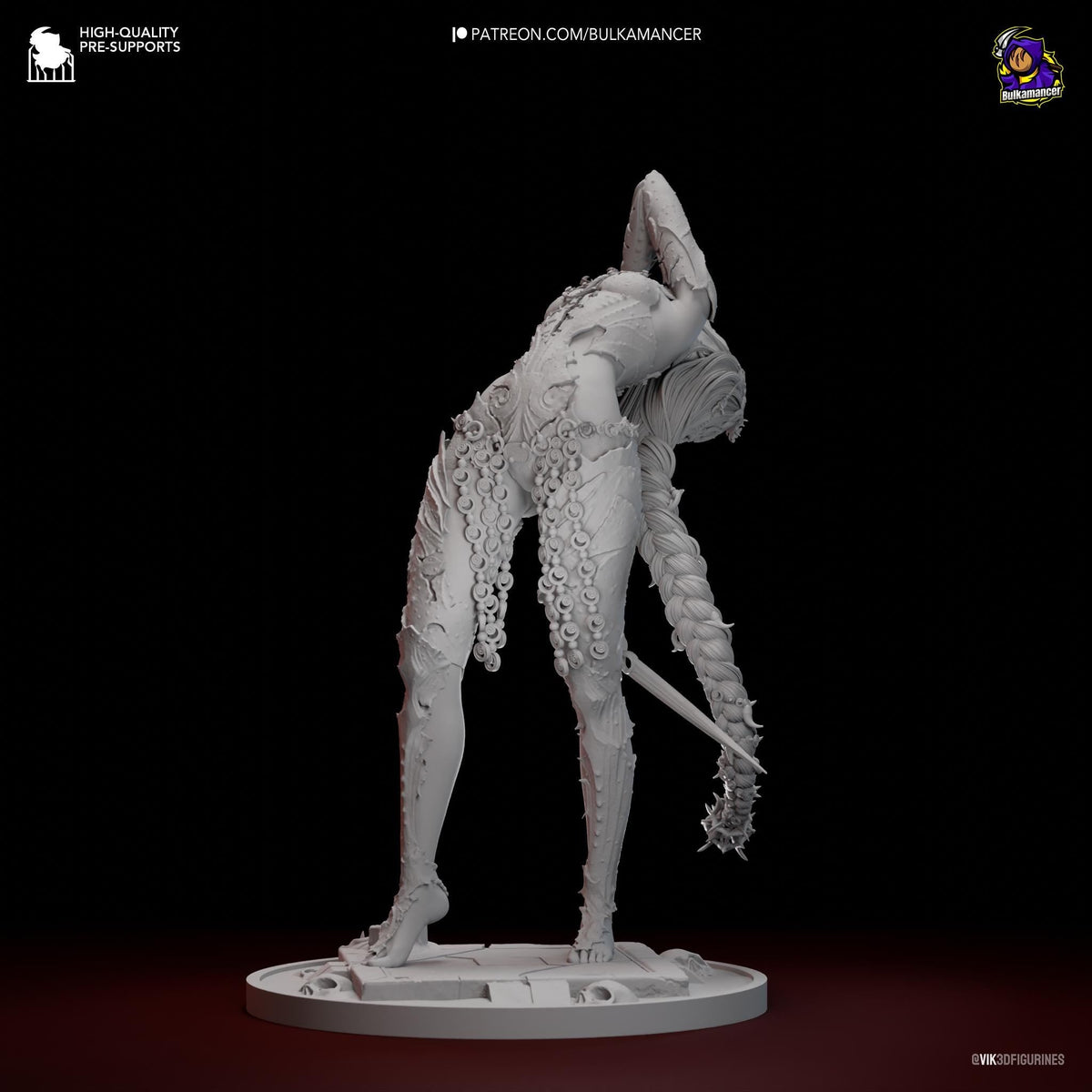 a white sculpture of a person with a sword