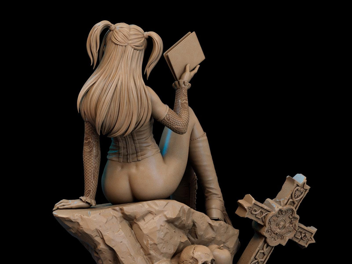 a statue of a woman sitting on top of a rock