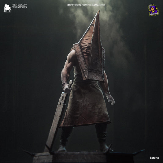 a statue of a man holding a sword